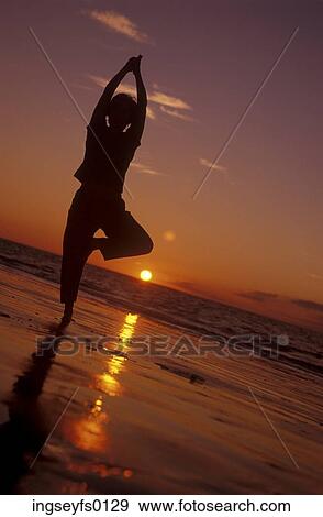 Yoga On The Beach At Sunset View Large Photo Image Stock Photo - Yoga On The Beach At Sunset. Fotosearch