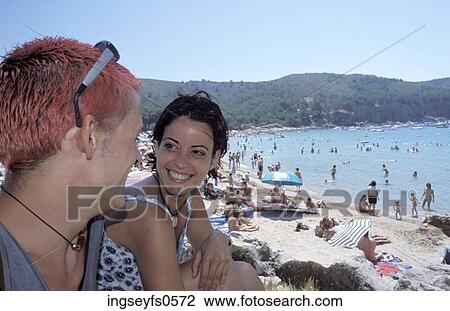 Young Couple at the Beach View Large Photo Image Stock Image - Young Couple at the Beach. Fotosearch