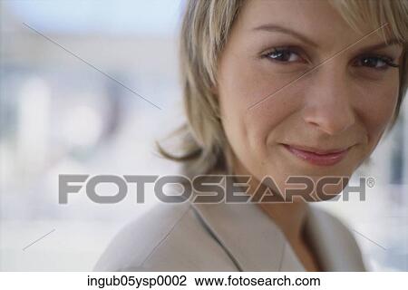 Close-up of a businesswoman smiling View Large Photo Image Stock Image - Close-up of a businesswoman smiling. Fotosearch