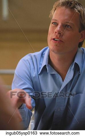 Close-up of a young man holding his hand out View Large Photo Image Stock Image - Close-up of a young man holding his hand out. Fotosearch