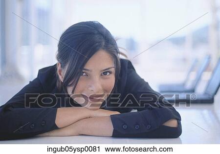 Close-up of a young woman lying down View Large Photo Image Stock Image - Close-up of a young woman lying down. Fotosearch