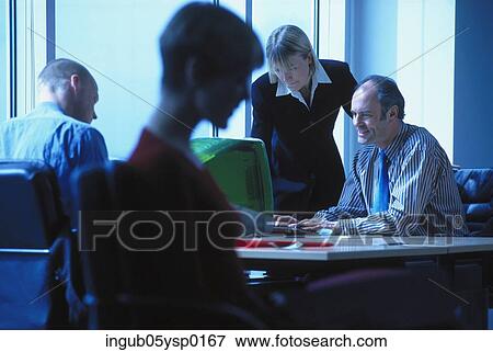 Group of people working in an office View Large Photo Image Stock Photo - Group of people working in an office. Fotosearch