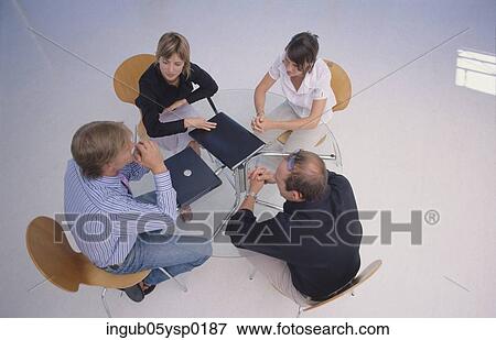 High angle view of four business executives in a meeting View Large Photo Image Stock Photo - High angle view of four business executives in a meeting. Fotosearch