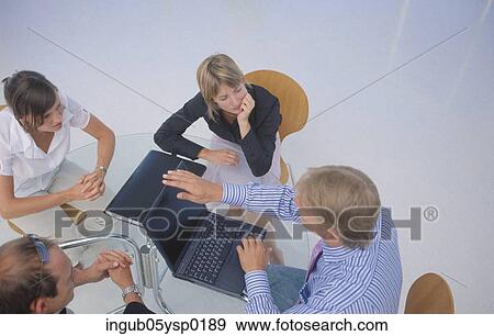 High angle view of four business executives in a meeting View Large Photo Image Stock Photo - High angle view of four business executives in a meeting. Fotosearch