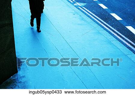 Low-section view of a young man crossing a road View Large Photo Image Stock Image - Low-section view of a young man crossing a road. Fotosearch