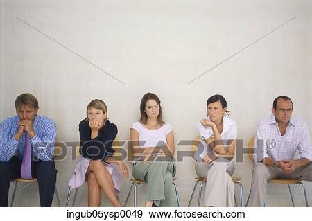 People sitting on chairs and waiting View Large Photo Image Stock Photo - People sitting on chairs and waiting. Fotosearch