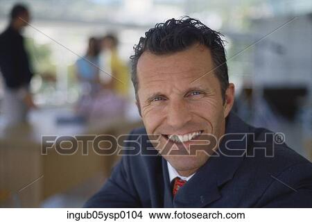 Portrait of a businessman smiling View Large Photo Image Picture - Portrait of a businessman smiling. Fotosearch