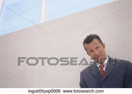 Stock Photograph - Portrait of a businessman smiling. Fotosearch