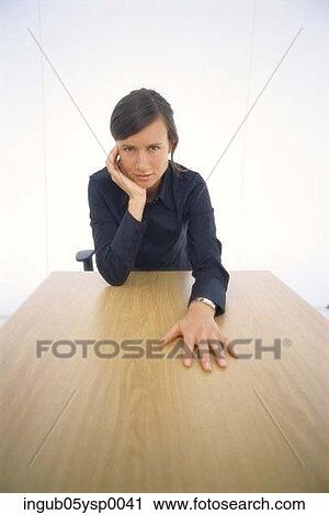 Portrait of a businesswoman sitting in a conference room View Large Photo Image Stock Image - Portrait of a businesswoman sitting in a conference room. Fotosearch