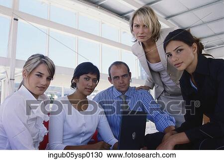 Portrait of a group of business executives sitting in an office View Large Photo Image Stock Image - Portrait of a group of business executives sitting in an office. Fotosearch
