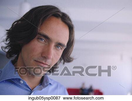 Portrait of a young man looking at the camera View Large Photo Image Stock Photo - Portrait of a young man looking at the camera. Fotosearch