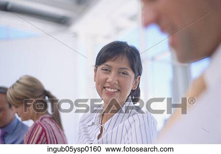 Stock Image - Portrait of a young woman smiling. Fotosearch