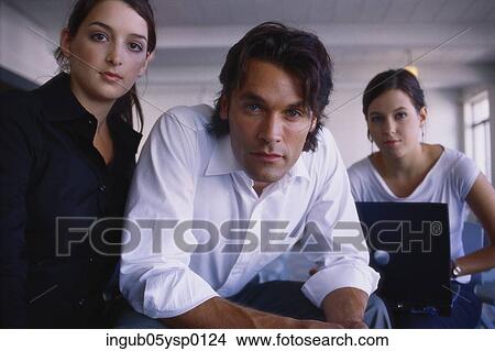 Picture - Portrait of two young women and a young man. Fotosearch