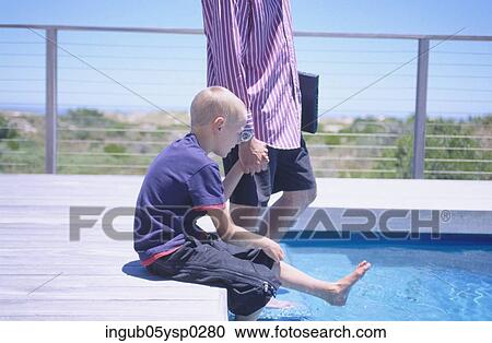 Side profile of a father and child at a poolside View Large Photo Image Stock Image - Side profile of a father and child at a poolside. Fotosearch