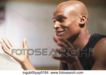 Side profile of a young man smiling View Large Photo Image Picture - Side profile of a young man smiling. Fotosearch