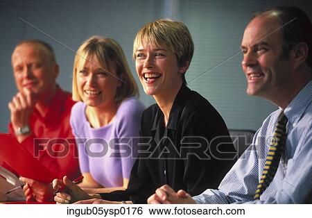 Side profile of business executives sitting in a meeting View Large Photo Image Stock Photograph - Side profile of business executives sitting in a meeting. Fotosearch
