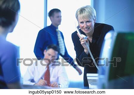 Young businesswoman talking on a telephone View Large Photo Image Stock Image - Young businesswoman talking on a telephone. Fotosearch