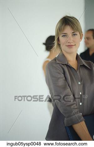 Young woman holding a file View Large Photo Image Stock Photo - Young woman holding a file. Fotosearch