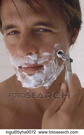 Close-up of a mid adult man shaving View Large Photo Image Stock Image - Close-up of a mid adult man shaving. Fotosearch