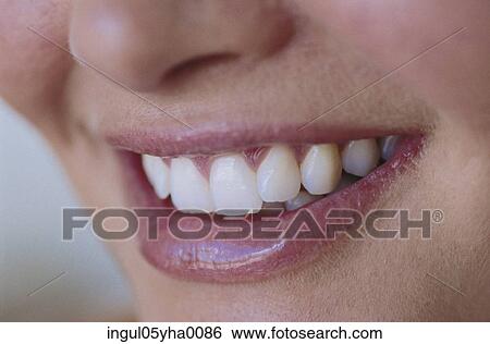 Stock Photograph - Close-up of a person smiling. Fotosearch