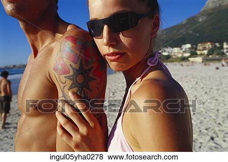 Close-up of a young couple on the beach View Large Photo Image Stock Photo - Close-up of a young couple on the beach. Fotosearch