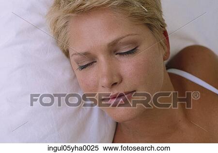 Close-up of a young woman sleeping View Large Photo Image Stock Photography - Close-up of a young woman sleeping. Fotosearch
