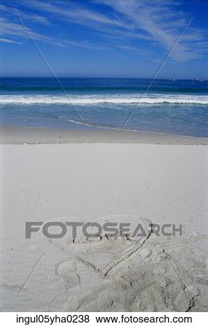 Heart drawn in the sand on the beach View Large Photo Image Stock Photo - Heart drawn in the sand on the beach. Fotosearch