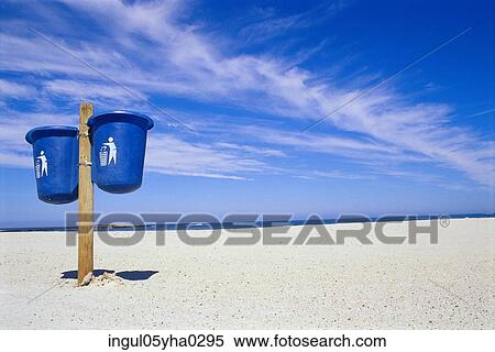 Low angle view of two trash bins on the beach View Large Photo Image Stock Photography - Low angle view of two trash bins on the beach. Fotosearch