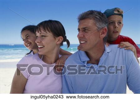 Parents with their son and daughter on the beach View Large Photo Image Stock Image - Parents with their son and daughter on the beach. Fotosearch