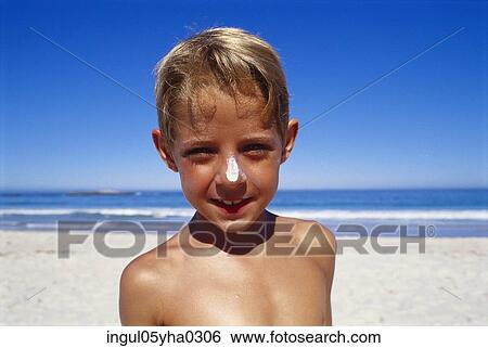 Portrait of a boy standing on the beach View Large Photo Image Stock Photograph - Portrait of a boy standing on the beach. Fotosearch
