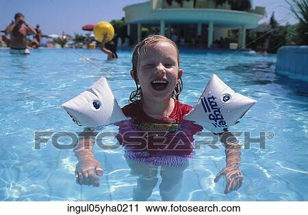 Portrait of a girl in a swimming pool View Large Photo Image Stock Image - Portrait of a girl in a swimming pool. Fotosearch