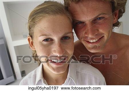 Stock Photo - Portrait of a young couple smiling. Fotosearch
