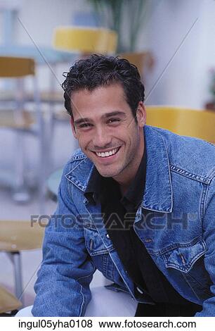Portrait of a young man smiling View Large Photo Image Stock Photo - Portrait of a young man smiling. Fotosearch