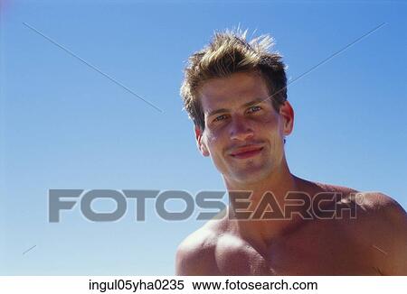 Stock Photography - Portrait of a young man smiling. Fotosearch