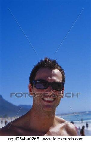 Portrait of a young man smiling View Large Photo Image Stock Photography - Portrait of a young man smiling. Fotosearch