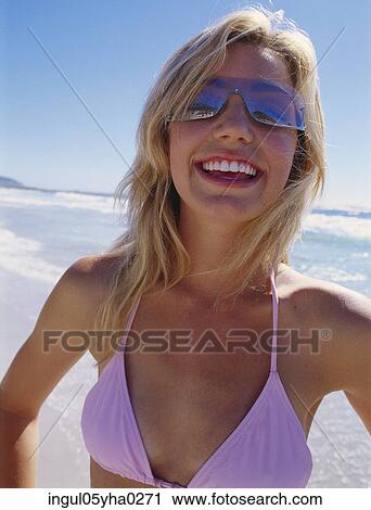 Stock Image - Portrait of a young woman smiling. Fotosearch