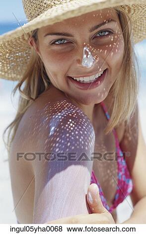Stock Photo - Portrait of a young woman smiling. Fotosearch
