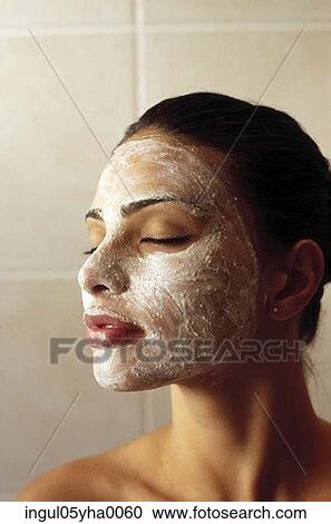 Portrait of a young woman wearing facial mask View Large Photo Image Stock Image - Portrait of a young woman wearing facial mask. Fotosearch