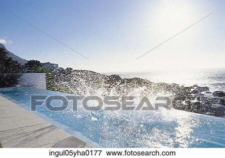 Water splashing from a swimming pool View Large Photo Image Stock Photo - Water splashing from a swimming pool. Fotosearch