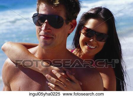 Stock Photography - Young couple on the beach. Fotosearch