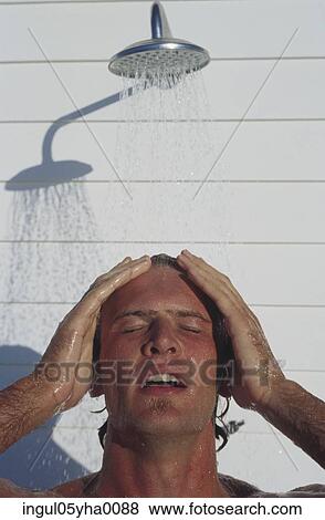 Young man taking a shower View Large Photo Image Stock Photo - Young man taking a shower. Fotosearch