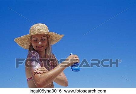 Young woman applying lotion on her hand View Large Photo Image Stock Photograph - Young woman applying lotion on her hand. Fotosearch