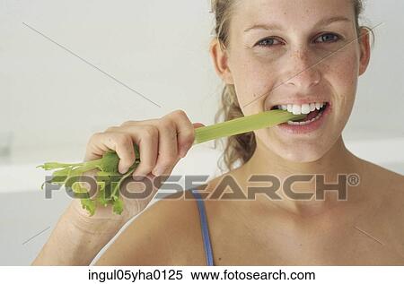Young woman eating lettuce View Large Photo Image Stock Photography - Young woman eating lettuce. Fotosearch