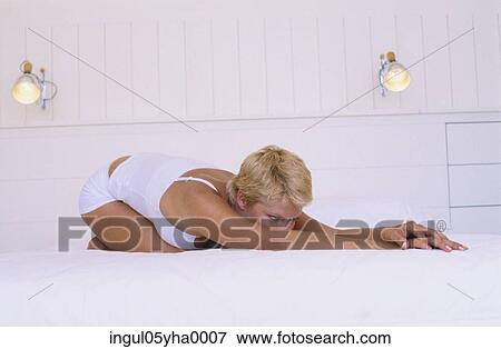 Young woman exercising View Large Photo Image Stock Photo - Young woman exercising. Fotosearch