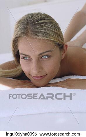Stock Photography - Young woman having a back massage. Fotosearch