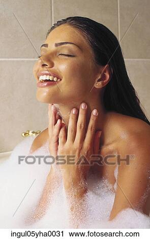 Young woman in a bubble bath View Large Photo Image Stock Image - Young woman in a bubble bath. Fotosearch