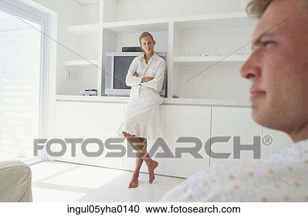 Young woman looking at a young man View Large Photo Image Stock Image - Young woman looking at a young man. Fotosearch