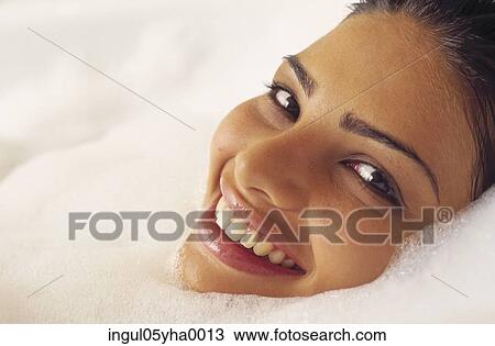 Young woman taking a bubble bath View Large Photo Image Stock Image - Young woman taking a bubble bath. Fotosearch