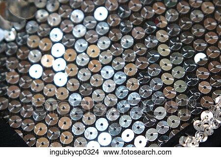 Close-up of a fabric covered with sequins View Large Photo Image Picture - Close-up of a fabric covered with sequins. Fotosearch