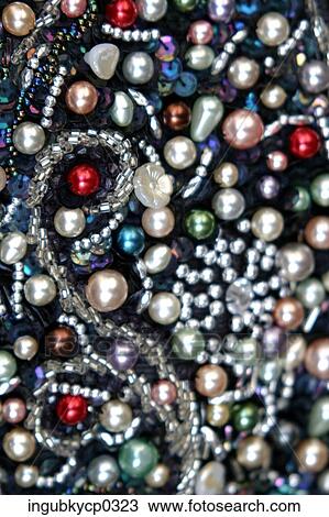 Close-up of a fabric with pearls and beads View Large Photo Image Stock Image - Close-up of a fabric with pearls and beads. Fotosearch
